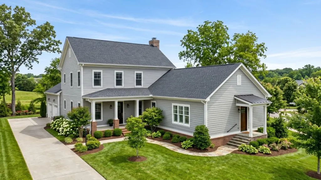 Multigenerational home in Middle Tennessee with attached mother-in-law suite wing, separate entrance, and matching roofline