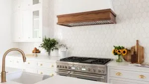 Mid-range kitchen remodel in Nashville TN with quartz island and white oak cabinets